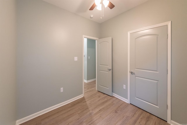 unfurnished room featuring ceiling fan and light wood-type flooring