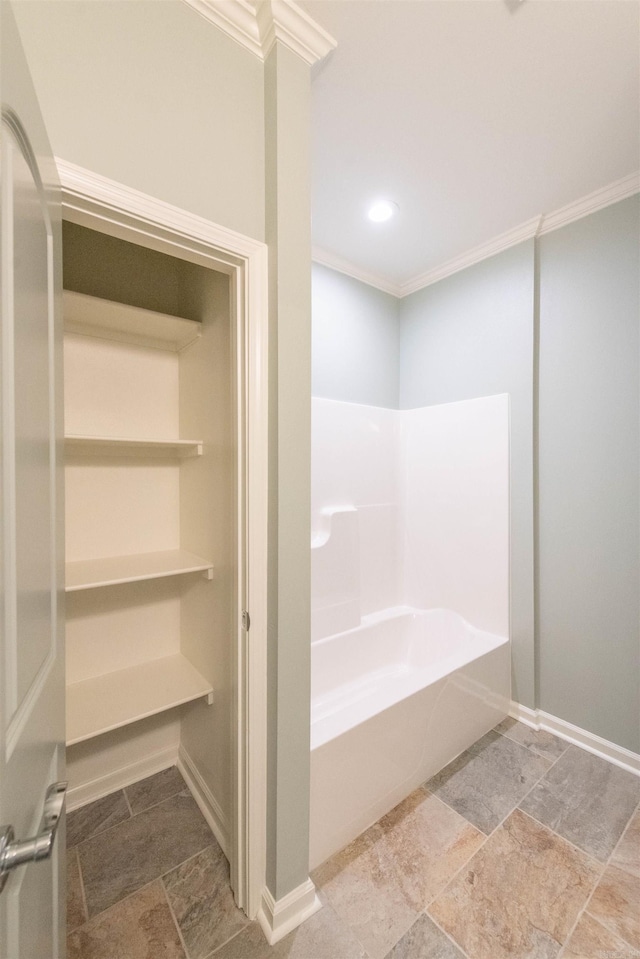 bathroom featuring tile floors and crown molding