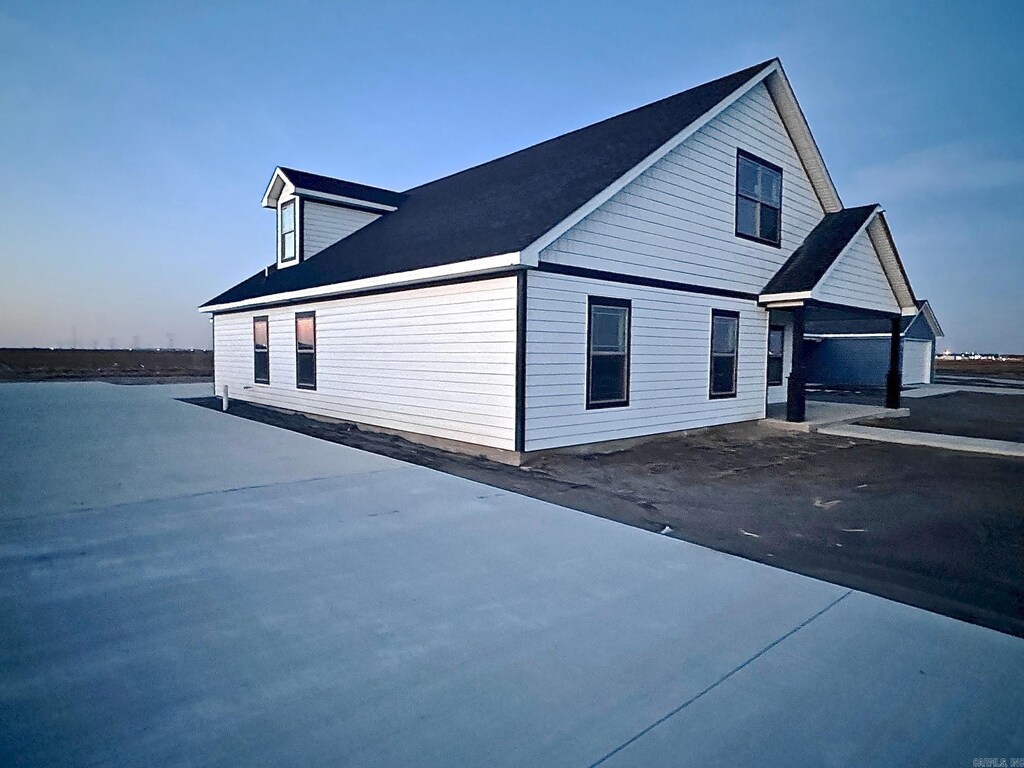 view of property exterior at dusk