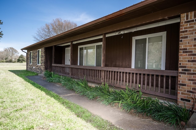 view of side of home featuring a yard