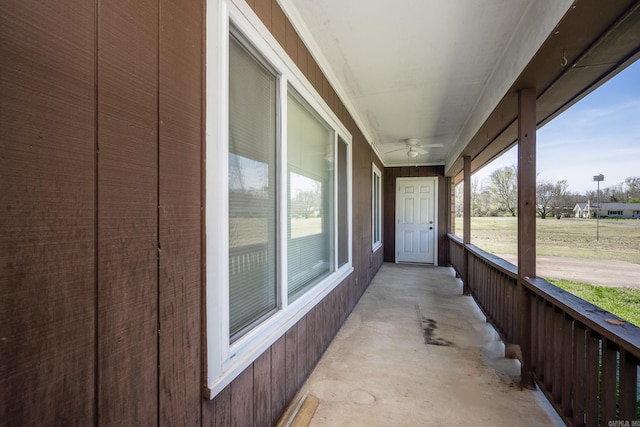 exterior space featuring ceiling fan