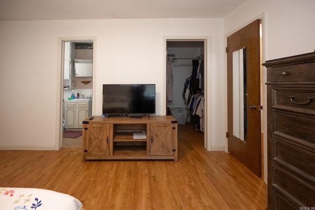 living room with sink and light hardwood / wood-style floors