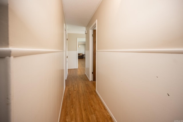 hall with light hardwood / wood-style floors