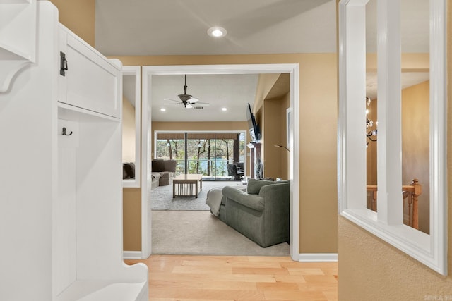 living room with ceiling fan and light carpet