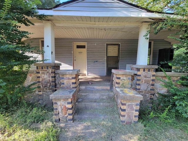 1501 Reeves Ave, Mena, AR 71953 - property entrance with a porch