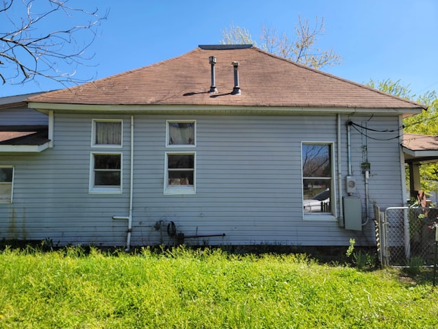 view of property exterior with a lawn