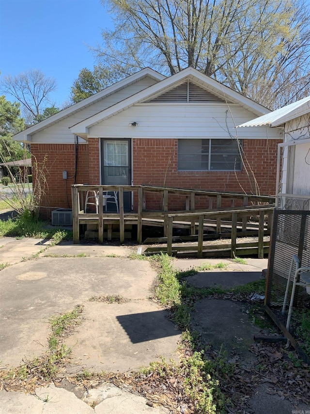 back of house with a deck