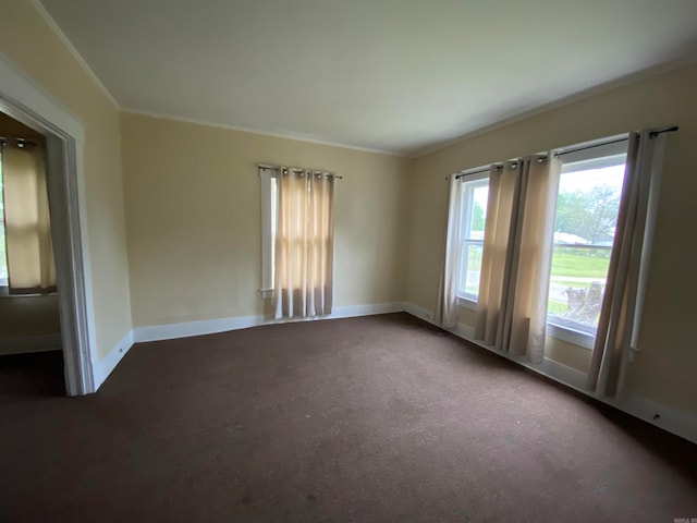 unfurnished room featuring dark carpet