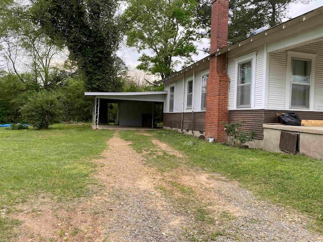 view of yard featuring a carport