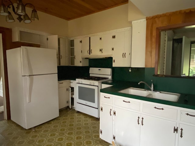 kitchen with a chandelier, wooden ceiling, white appliances, white cabinets, and sink