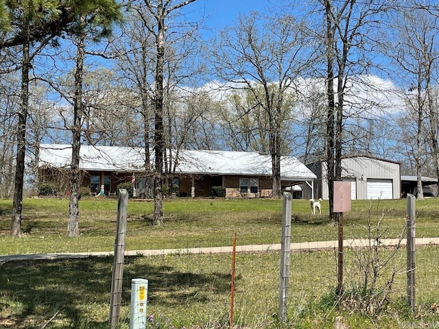 view of front facade featuring a front lawn and a garage