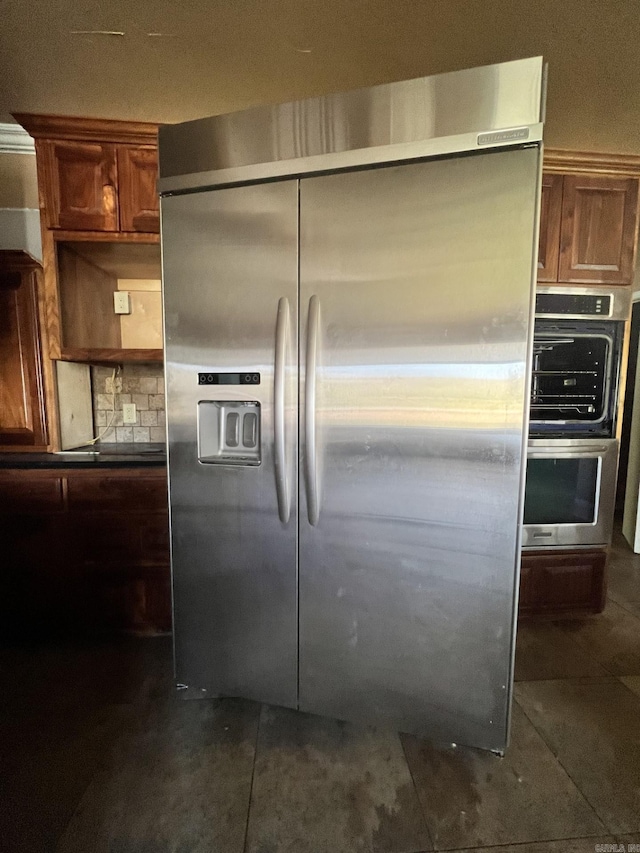 kitchen with tasteful backsplash and stainless steel appliances