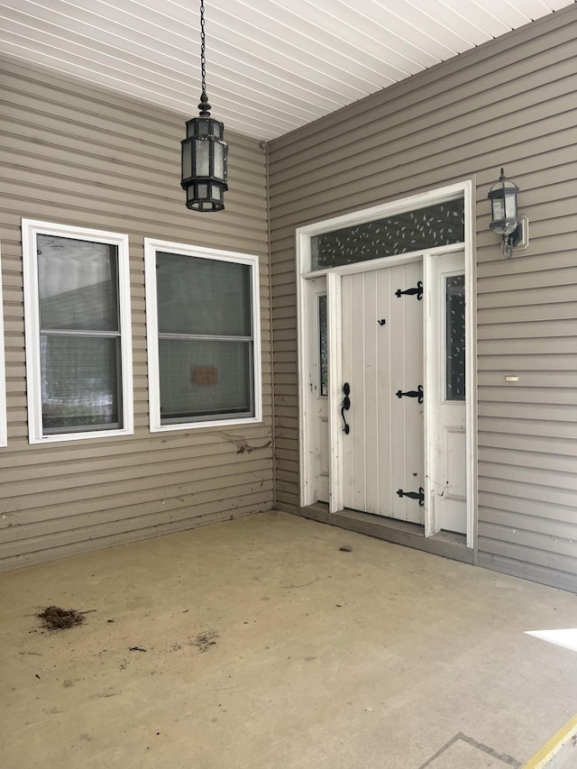 entrance to property featuring a patio