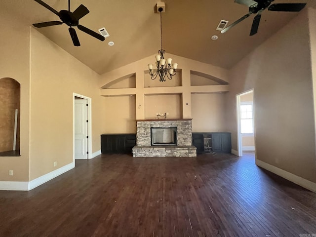 unfurnished living room with a fireplace, ceiling fan with notable chandelier, and dark hardwood / wood-style floors