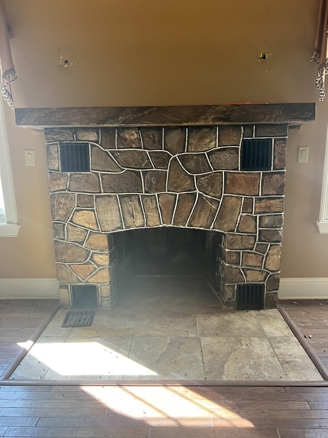 details featuring dark wood-type flooring and a fireplace