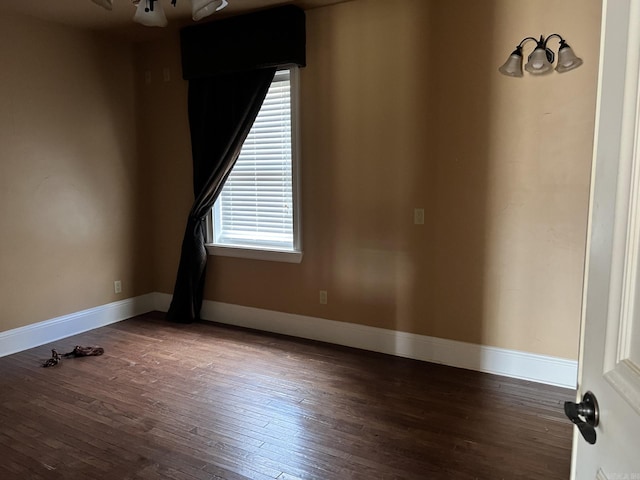 unfurnished room featuring dark hardwood / wood-style flooring