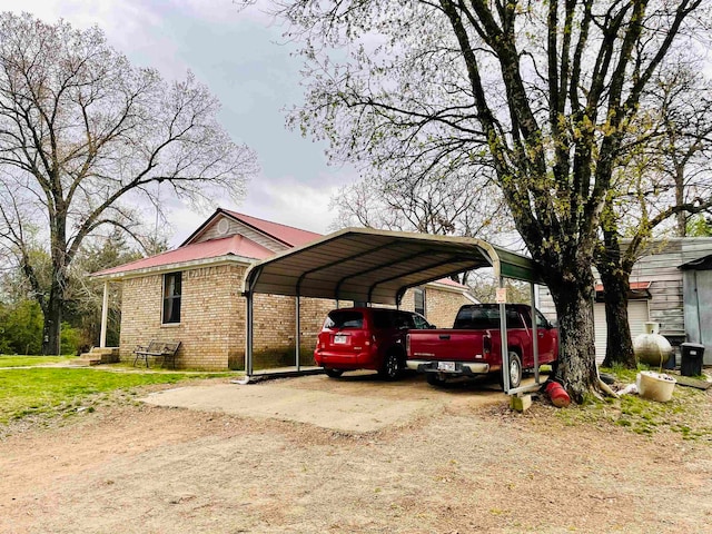 view of vehicle parking featuring a carport