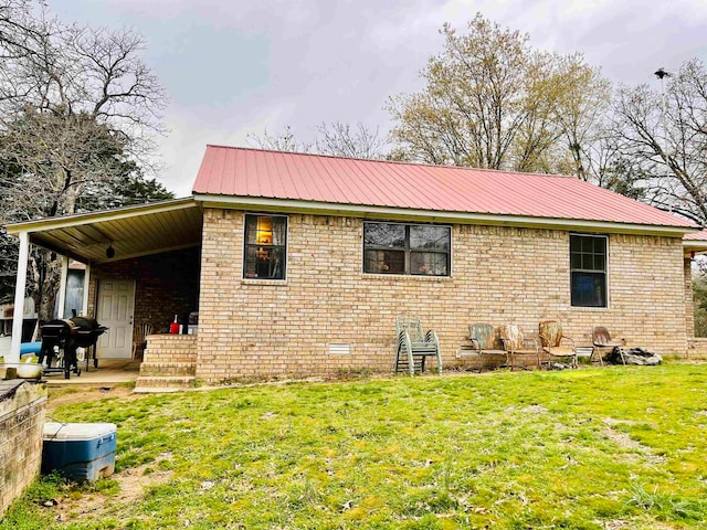 exterior space with a patio area and a lawn