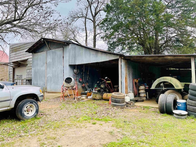 view of outbuilding with a carport