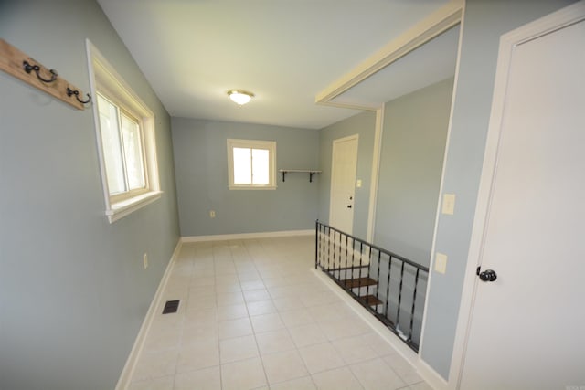 hallway with light tile flooring