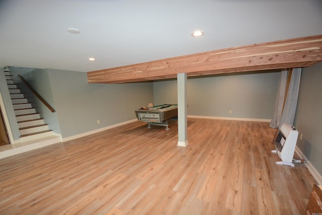 basement with light hardwood / wood-style floors