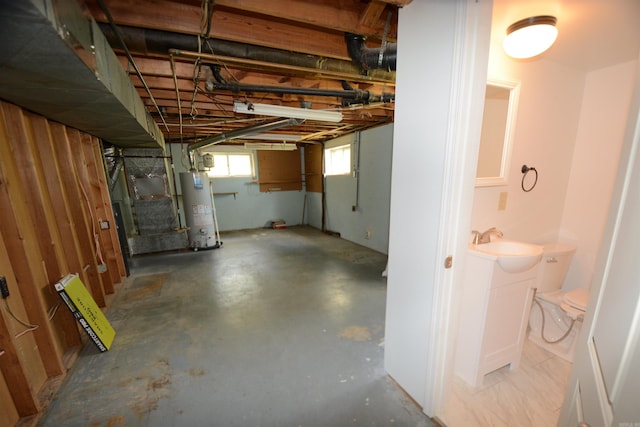 basement with sink and gas water heater