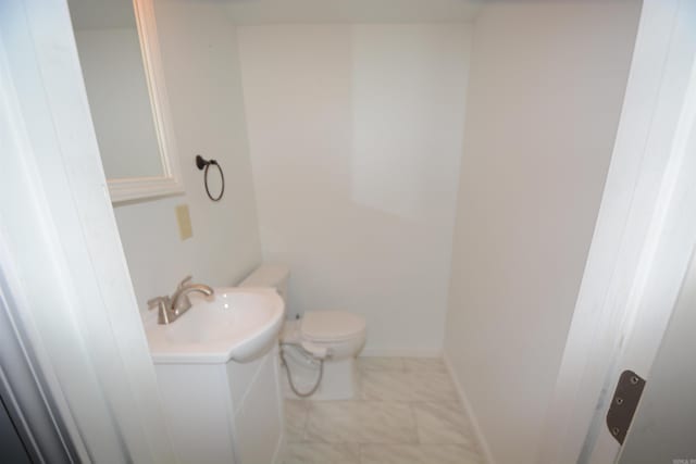 bathroom with vanity, tile flooring, and toilet