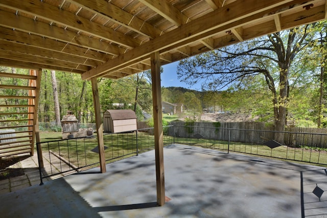 view of patio with a storage shed