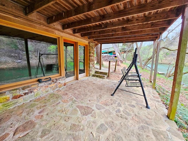 view of patio featuring french doors and a water view