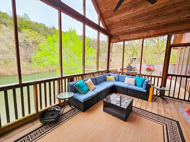 sunroom / solarium featuring vaulted ceiling