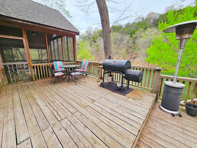 wooden deck featuring grilling area