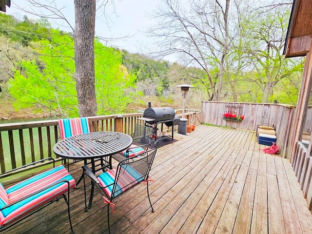 wooden terrace with area for grilling