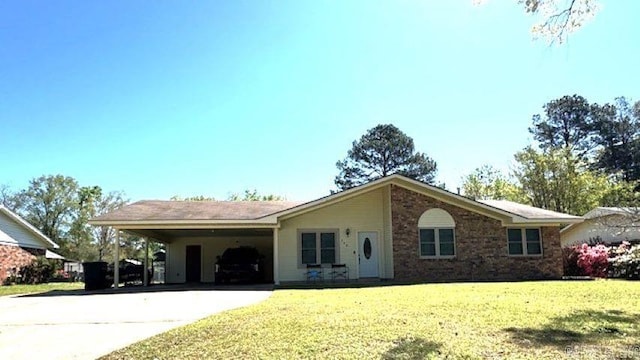 ranch-style house with a carport and a front lawn