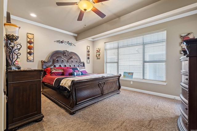 carpeted bedroom with ceiling fan and crown molding