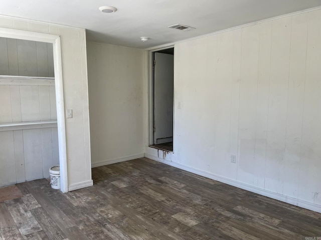 unfurnished bedroom featuring dark hardwood / wood-style floors