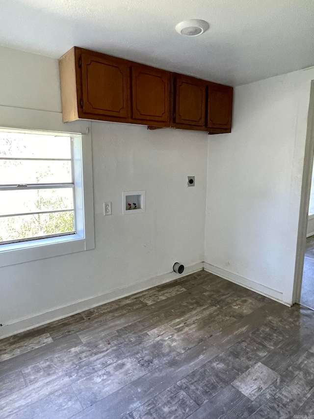 clothes washing area with hookup for a washing machine, dark hardwood / wood-style flooring, cabinets, and electric dryer hookup