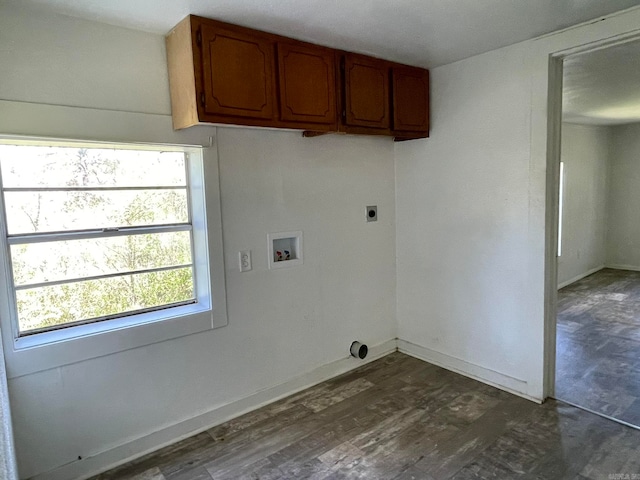 washroom featuring hookup for a washing machine, cabinets, electric dryer hookup, and dark wood-type flooring