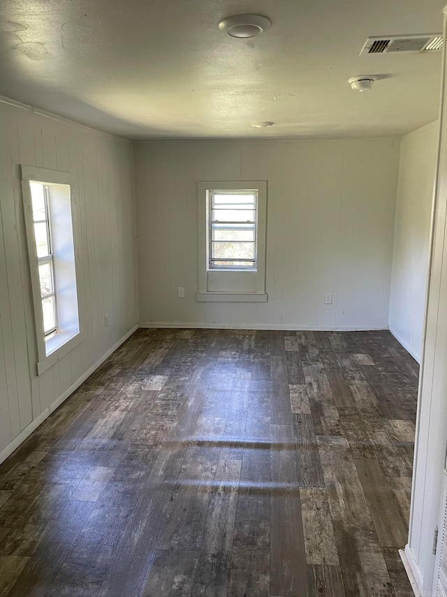 empty room featuring dark hardwood / wood-style floors