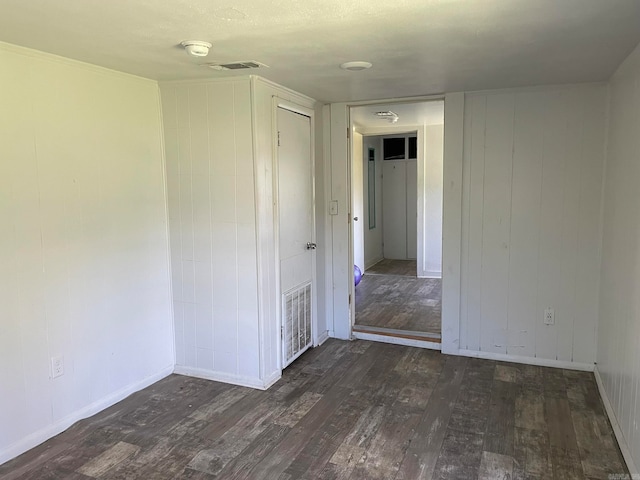 empty room featuring dark hardwood / wood-style flooring