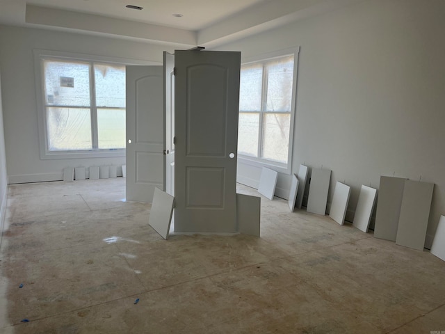 unfurnished room featuring plenty of natural light