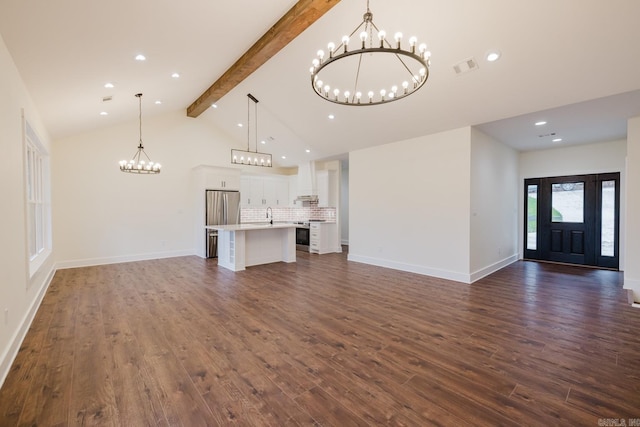 unfurnished living room with lofted ceiling with beams and dark wood-type flooring