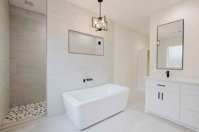 bathroom featuring vanity, shower with separate bathtub, tile walls, and an inviting chandelier