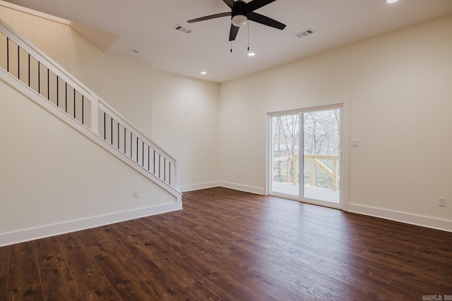 unfurnished living room with ceiling fan and dark wood-type flooring