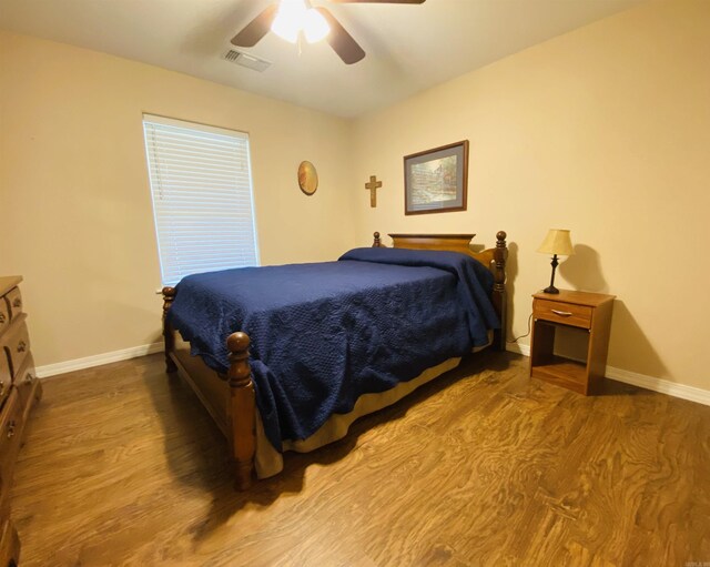 500 E Ingram St, E Camden, AR 71701 - bedroom featuring baseboards, visible vents, wood finished floors, and a ceiling fan