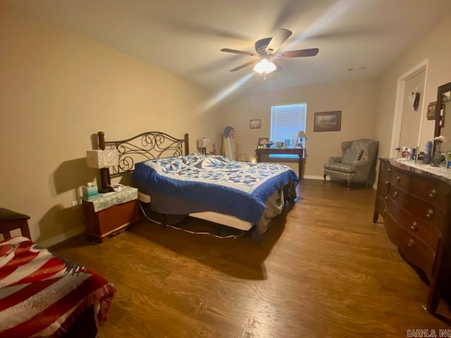 500 E Ingram St, E Camden, AR 71701 - bedroom featuring baseboards, wood finished floors, and a ceiling fan