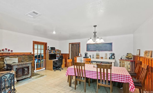 tiled dining area featuring a notable chandelier