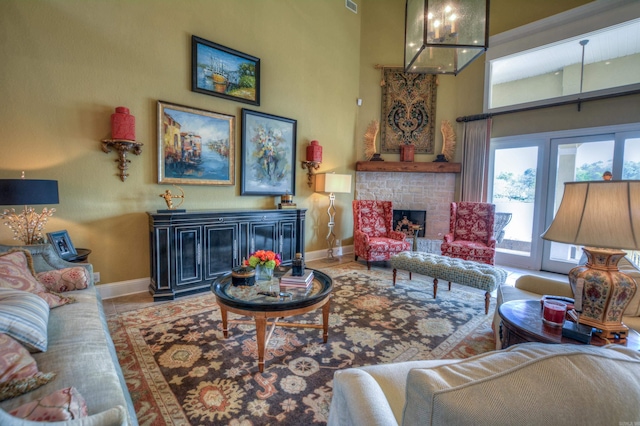 living room with a fireplace and light tile floors