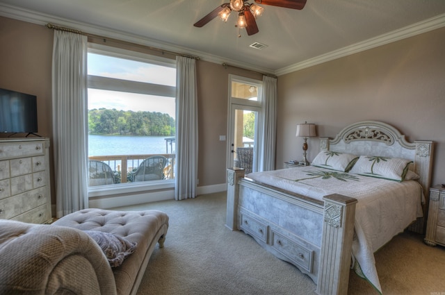 bedroom with crown molding, a water view, light colored carpet, and ceiling fan