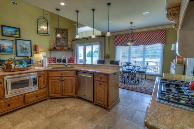 kitchen featuring light tile flooring, stainless steel appliances, decorative light fixtures, sink, and light stone countertops