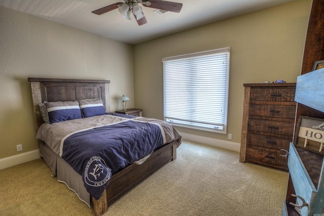 bedroom featuring light colored carpet and ceiling fan